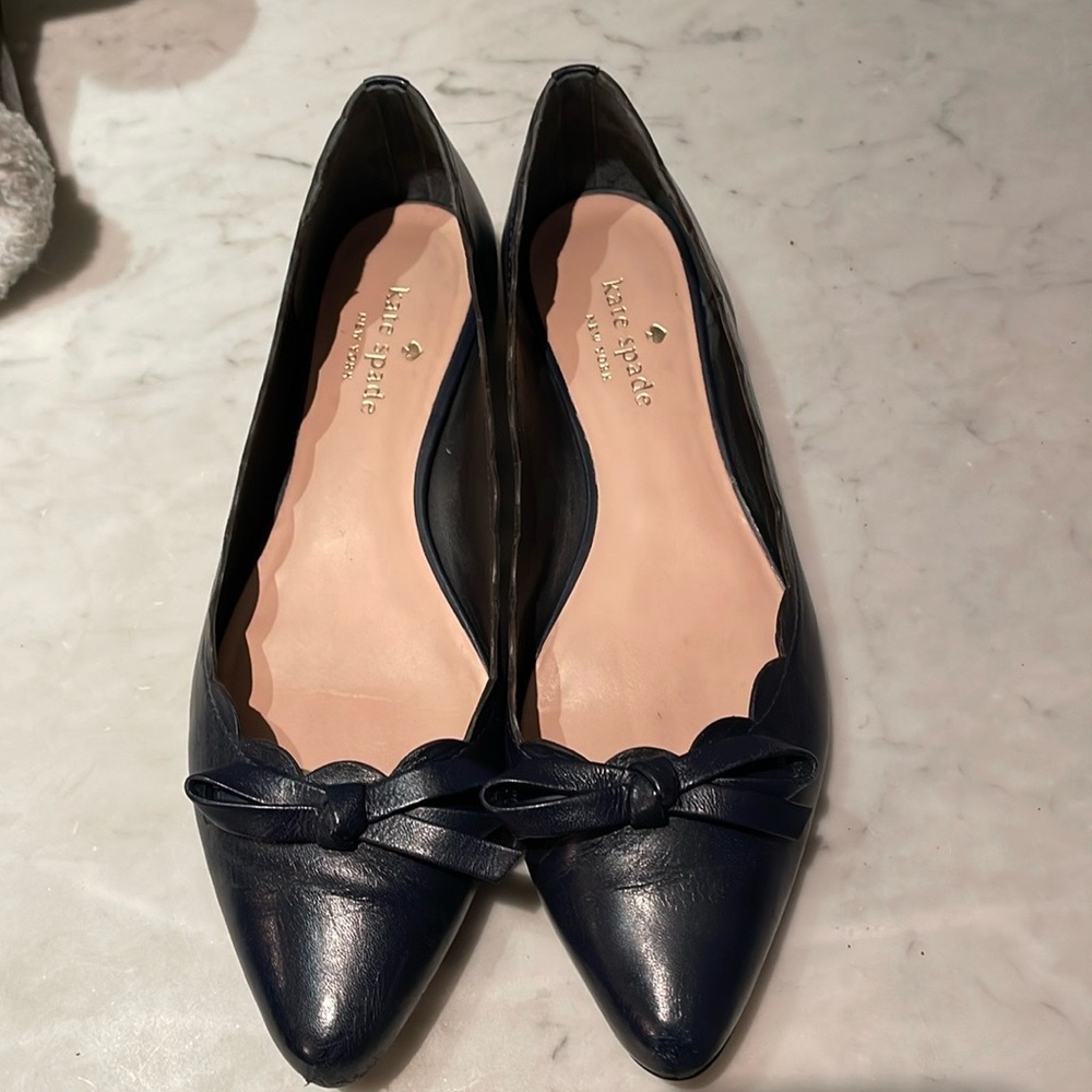 Adorable dark navy Kate Spade ballet flats with bow and scalloped detail